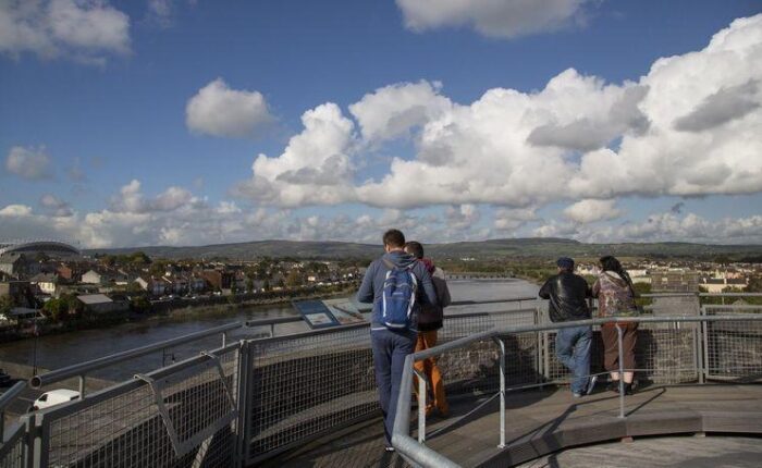 People admire view of Limerick city atop King Johns Castle.